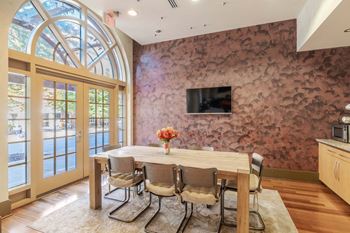 A dining room with a table set for four